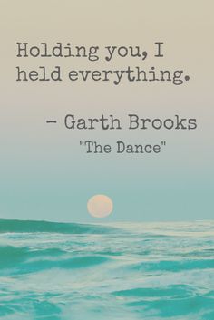 the ocean with a quote on it that says holding you i held everything, gart brooks