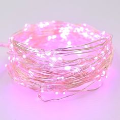 pink fairy lights on white background