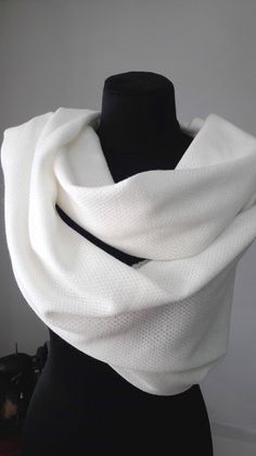 A warm and beautiful shawl made of ivory knitted mixed fabric, perfect to wear everyday or on a special occasion, wedding, party and other. Beautiful shawl to to warm you up on a cold but beautiful day... to add an elegant touch to your look. For more wedding tops and boleros, please access https://www.etsy.com/shop/LidiasBoutiqueDesign?ref=seller-platform-mcnav&section_id=23157300. For more wedding dresses, please access https://www.etsy.com/shop/LidiasBoutiqueDesign?ref=seller-platform-mcn Winter Wedding Shawl Scarf, Elegant Winter Wedding Pashmina Shawl, Elegant Handmade Scarves For Weddings, Handmade Shawl Scarf For Wedding, Handmade Shawl Scarves For Wedding, Elegant Handmade Shawl Wrap, Elegant Handmade Shawl As Gift, Elegant Handmade Shawl For Gift, White Shawl Scarves As Gift