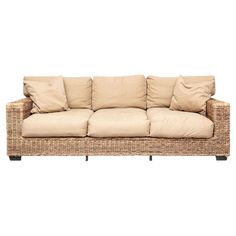 a wicker couch with four pillows on it's back and two side ends