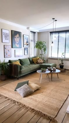 the living room is clean and ready for us to use it's natural wood flooring