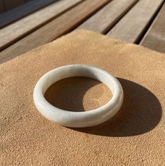 57.45 mm Round bangle. Fits 56/57/58   white jadeite jade bangles, clean white base, simple and cool looking, easy matching with any of your outfits, a true everyday, everywhere look. *To find out your bangle size: Measure your palm sizes  ( last image ) at the widest point in Millimeter(mm), with that number minus (-)16 is your bangle size.  usually Plus/minus -) 2mm works well too, depending on a very slightly loose or snug fit. * No visible stone vein & no rough surface on this bangle. Hand measurement: Inner diameter: 57.45 mm                  Width: 11.55 mm           Thickness: 7.67 mm All items in my shop are carefully selected, You are paying for the price of its best quality, Fine, and smooth jade base. Every single jade is unique on its own, due to the nature of the product. You Handmade White Jade Bracelets, White Minimalist Bangle, White Bangle For Gift, Handmade Round Jade Bangle, Jade Bangle, Plus And Minus, Natural Jade, Burmese, Bangle Bracelet