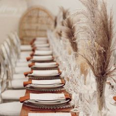 the table is set with place settings and silverware