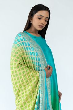 Green and peacock blue ombre kurta in an asymmetric silhouette. Comes with an ombre banarasi dupatta featuring woven floral zari pattern and bandhej motifs. - Aza Fashions Designer Wear Slub Silk Dupatta With Bandhani Print, Blue Jamawar Churidar With Dupatta, Festive Turquoise Sheer Dupatta, Festive Green Bandhani Print Churidar, Silk Anarkali Kurta With Bandhani Print, Cotton Silk Dupatta With Bandhani Print For Wedding, Blue Jamawar Dupatta, Turquoise Silk Dupatta For Wedding, Turquoise Silk Dupatta