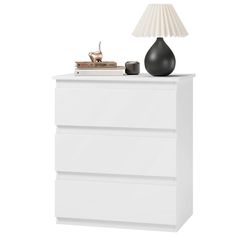 a white chest of drawers with a lamp on top