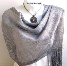 "With a pretty scarf you can look gorgeous for very little money and is the most versatile accessory you could have in your closet. Our scarves are chic and affordable and they add a fun and happy punch to any outfit. Dark silver gray metallic mesh with fringe shawl. Elegant lightweight stole. The scarf is wide long enough to wrap around twice. Very stylish! 64\" long and 19\" wide ( fringe is 6\" long)." Outfit Dark, Evening Wrap, Evening Shawls, Fringe Shawl, Gray Wedding, Pretty Scarves, Grey Scarf, Wedding Shawl, Wedding Wraps