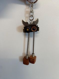 Discover a blend of creativity and steampunk flair with this hand-assembled robot keychain. Each keychain is a unique creation, designed and put together by hand using carefully selected parts to form a quirky, industrial-style accessory that stands out. Key Features: Hand-Assembled Design: While the components such as the "ears," "eyes," chains, and blocks are sourced from various suppliers, the design and assembly are entirely my own. Each piece is carefully constructed to create a cohesive and eye-catching robot figure. Steampunk Aesthetic: Featuring metal gears, bolts, and chains, this robot keychain embodies the vintage, industrial chic of the steampunk genre. Versatile Use: This keychain is perfect not only as a keyring but also as a bag charm or a unique gift for those who appreciat Robot Keychain, Steampunk Robot, Steampunk Aesthetic, Upcycled Gifts, Style Steampunk, Metal Gear, Industrial Chic, Gifts For Men, Industrial Style