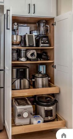 an organized kitchen pantry with appliances and other items