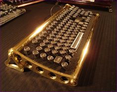 an old typewriter sitting on the floor with lots of bottles in it's holder