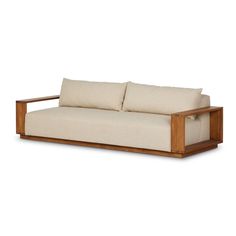 a wooden couch with two pillows on it's back and the seat upholstered