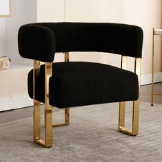 a black chair sitting on top of a carpeted floor next to a white wall