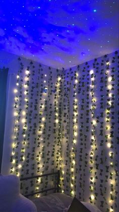 a bedroom decorated with lights and curtains