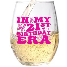 a wine glass filled with liquid and the words,'my 21st birthday bra '