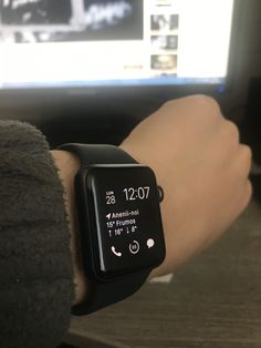 an apple watch on someone's wrist with the time displayed in front of them