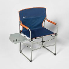 a blue and orange camping chair sitting on top of a table