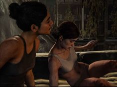 two women are sitting on a couch in a video game, one is touching the other's hand