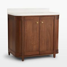 a wooden cabinet with a white counter top