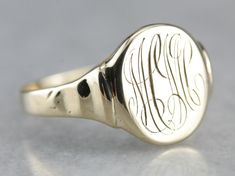 "This vintage signet ring has a fantastic polish and a pretty flowing script of the original \"MCM\" monogram! Signet rings have a long history. Originally carved with a Family Crest, they were used to seal letters and documents by embossing the crest in wax. Please note that this signet ring has its original monogram, unfortunately, this piece cannot be altered without affecting the quality of the piece, please feel free to contact us to help you find your perfect signet ring in your style and Chrome Candle Holders, Yellow Gold Sapphire Ring, Wooden Candle Sticks, Wood Candle Sticks, Signet Rings, Vintage Monogram, Cameo Ring, Gold Top, Key Design