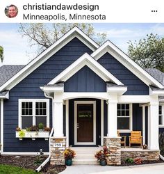 a blue house with white trim and two front porches on the first floor is shown