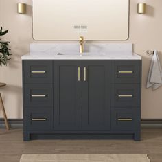 a bathroom vanity with a large mirror above it and a rug on the floor next to it