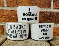 three coffee mugs that say i sold myself while they are sitting on top of each other