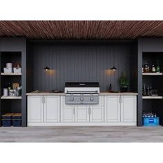 an outdoor kitchen is shown with white cabinets and yellow counter tops, along with black walls