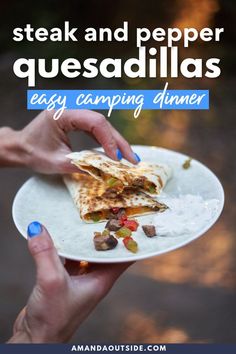 a person holding a plate with food on it and the words steak and pepper quesadillas easy camping dinner