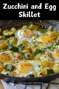 an egg skillet with zucchini and eggs in it