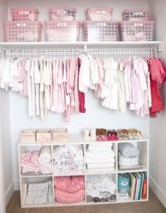 the closet is filled with baby clothes and other things to put on it's shelves