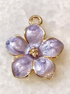 3 dainty lavender purple enamel and gold tone flower charms - pearlized design shiny petals - gold centerListing is for 3 charmsShiny lavender light purple enamel flowers Gold tonePearlized shiny petals Daisy flowerNature Flower charmsBouquet Bracelet- necklace - pendant Children’s jewelryPerfect for all your DIY creations Measurement 18 mm x 15 mm Lavender Flower Charm Jewelry, Lavender Flower Jewelry With Flower Charm, Lavender Flower-shaped Jewelry With Flower Charm, Yellow Aesthetic Vintage, Gold Lipstick, Enamel Flowers, Childrens Jewelry, Enamel Flower, Lavender Purple