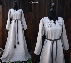 Viking linen / hemp dress decorated with dragon embroidery and hand embroidery around neck.  Front part of dress is made of double layerd hemb fabric, rest of the dress is made of pure natural coloured linen.  Dress available in 2 options :  1. Dress in stock - dress as pictured in photos, fits to this measurements : Chest : 100 -106 in circumference Hips : 98 - 112 in circumference Arm length from neck to wrist : 68 - 72 cm Biceps part of the arm : 28 - 32 Length : 152 cm (from the tip of the s White Viking Dress, Traditional Embroidered Linen Dress, Mideval Dress, Midevil Dress, Scandinavian Dress, Medieval Dresses, Gaun Abad Pertengahan, Hemp Dress, Aged Clothing