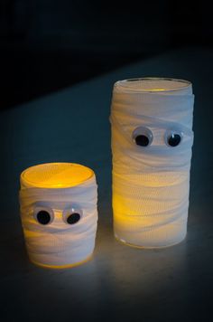 two plastic cups with googly eyes on them