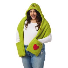 You'll be wearing a Grinchy grin whenever you enjoy winter activities in this handy hooded scarf. Cozy green scarf features a Grinch face embroidered on the hood and includes two large pockets on the ends of the scarf for warming your hands or carrying necessities. A red heart-shaped appliqué on one of the two pockets adds heartwarming charm to the soft fleece scarf. It makes a fun gift for a teacher, college kid or Grinch fan. | Green Grinch hooded scarf features embroidered and appliqué accents on the hood and one pocket. | Makes a great gift for Grinch fans. | Imported. 100% polyester. | Hand wash. Do not bleach. Hang to dry. Do not iron. Do not dry clean. | 68'' L Hooded Scarf With Pockets, Scarf With Pockets, Grinch Who Stole Christmas, Grinch Face, The Grinch Stole Christmas, Tyler Candles, Enjoy Winter, Fleece Scarf, Blue Q