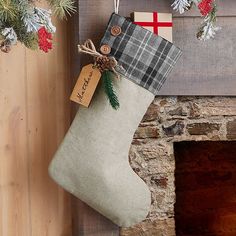 a christmas stocking hanging from a mantel