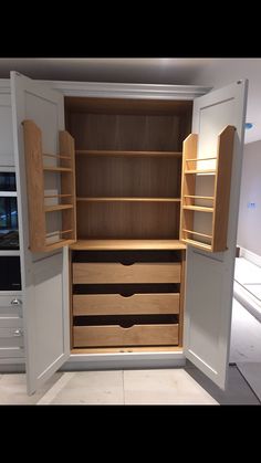 an empty closet with drawers and shelves in it