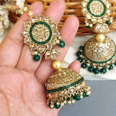 This Lightweight Golden Color Indian Traditional Karisma Green Jhumka with Tikka Set for the Bride is very much in high trend and gives you a real ethnic as well as royal look. Gold-toned Kundan jewellery set has a floral base with stone-studded detail. This set is designed for all age groups from college-going girls to housewives. This is a handcrafted Green Jewellery Set with good quality Kundan and stone drops. For more, check out our latest fashion and Kundan maang tikkas and necklace set. Luxury Green Jhumkas With Hand Set, Bohemian Green Jhumkas For Festivals, Festive Green Jhumkas, Luxury Hand-set Green Jhumkas, Earrings For Saree, Green Intricate Fusion Jhumkas, Maang Tikka Design, Tikka Designs, Kundan Jewellery Set