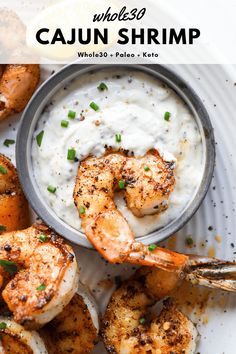 grilled shrimp with white sauce and scallops on a plate