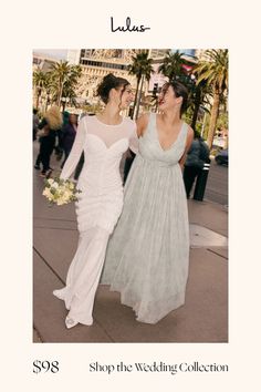 two brides walking down the street in their wedding gowns, with palm trees behind them