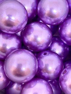 purple pearls are piled on top of each other