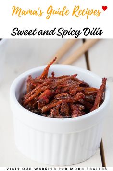 a white bowl filled with sweet and spicy chilis on top of a wooden table