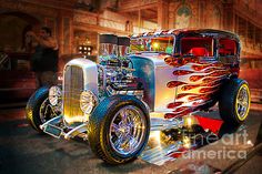 an antique hot rod car with flames on it