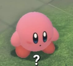 an image of a pink object with question mark on it's face in the grass