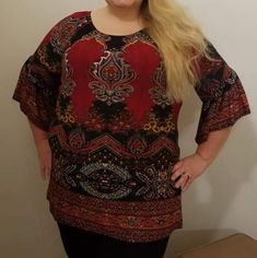 Ruby Red Paisley Baroque Tunic Top With Shades Of Ruby Red, Toll Blue, Black, Maize, White, Orange, True Red, And Gold. Fully Elastic Neck Can Be Worn Off Or On The Shoulder. It Has Angel Sleeve 3/4 Sleeve Length. Great For Fall And Winter! 30" Length Straight Bottom Hem. 92% Poly/8% Spandex Fits True To Size. Available In: 1x 14/16 2x 18/20 3x 22 24 Note- This Is A New Boutique Item From Our Store. The Item In The Photo May Not Be The Exact One You Receive. Pattern Locations May Differ Due To M Red Stretch Bohemian Top, Black Bohemian Tops With Paisley Print, Boho Plaid, White Boho Tops, Short Sleeve Tunic Tops, Floral Print Tunic, Brown Blouse, Plus Size Fall, Pink Tunic