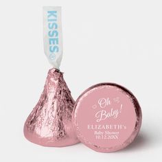 a pink foiled herss candy with a baby on it's sticker