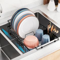 a dish rack filled with plates and utensils