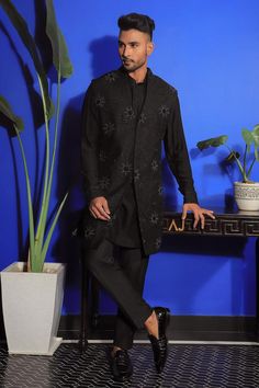 Black long sleeves bandhgala in silk base with all over buttercup flora embroidery using cut dana highlights. Paired with a kurta and trouser.
Components: 3
Pattern: Embroidery
Type Of Work: Buttercup
Neckline: Mandarin Collar
Sleeve Type: Long
Fabric: Silk, Stretch Cotton
Color: Black
Occasion: Cocktail and Reception - Aza Fashions Designer Nehru Jacket With Chikankari Embroidery For Party, Black Bandhgala With Floral Embroidery For Designer Wear, Festive Bandhgala With Floral Embroidery For Party, Festive Party Bandhgala With Floral Embroidery, Festive Black Bandhgala With Floral Embroidery, Designer Black Bandhgala With Floral Embroidery, Winter Black Embroidered Bandhgala, Elegant Embroidered Black Bandhgala, Black Embroidered Bandhgala Kurta