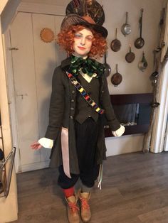 a doll dressed in an old fashion outfit