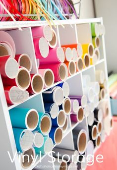 a rack filled with lots of different colored paper