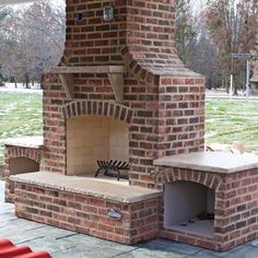 an outdoor brick pizza oven sitting on top of a patio