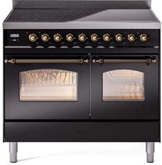 an old fashioned black stove with two ovens on it's sides and gold knobs